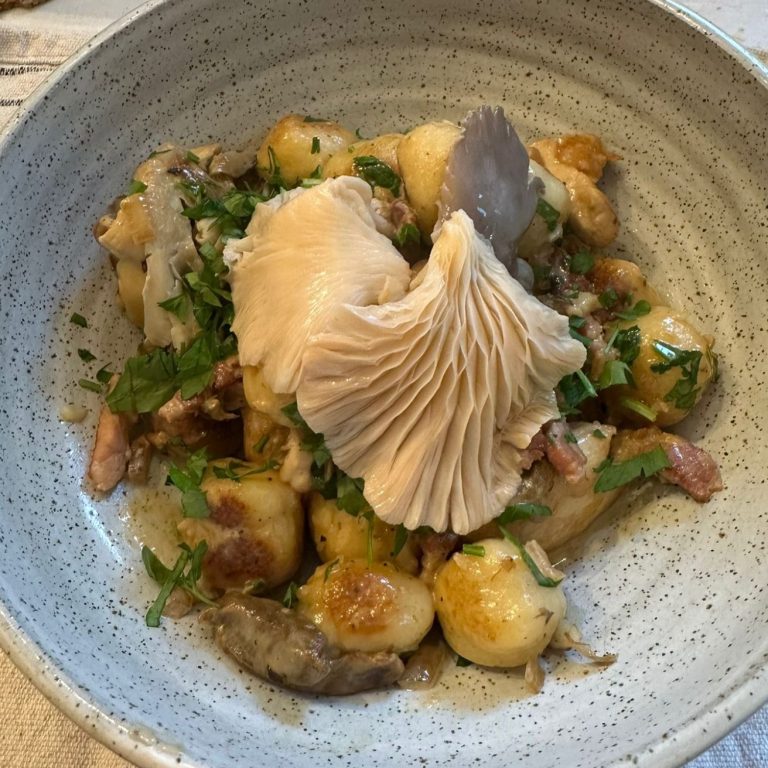 A restaurant dish finished with oyster mushrooms